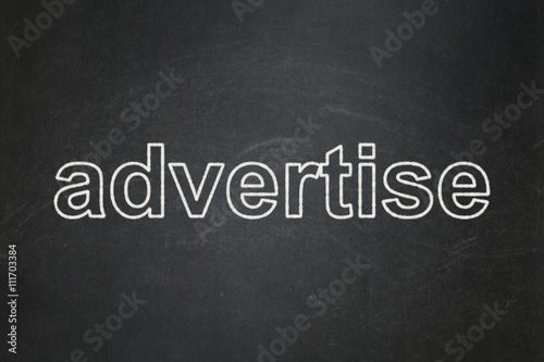 Advertising concept: Advertise on chalkboard background