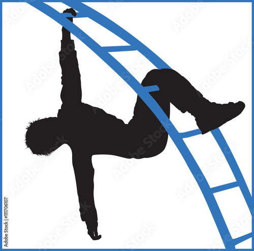 boy climbing a jungle gym at the park