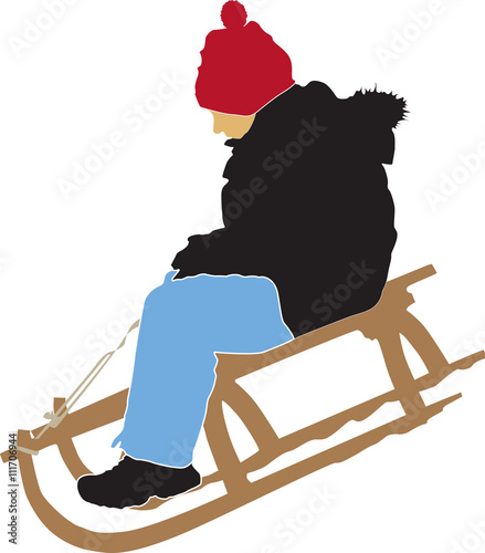 boy sledging down on the snow