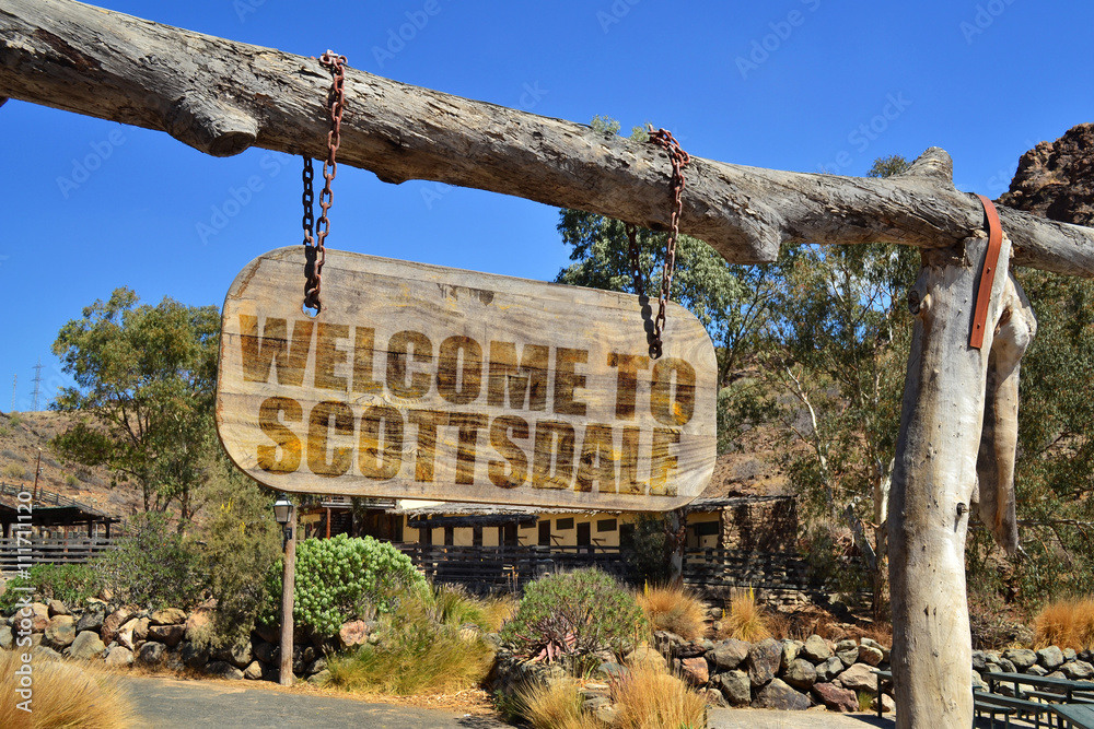 Ταπετσαρία wood signboard with text  welcome to Scottsdale hanging on a branch