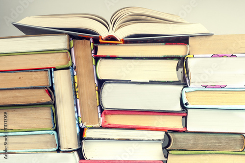 A set of books in the library. Knowledge, Science. Toned image. photo