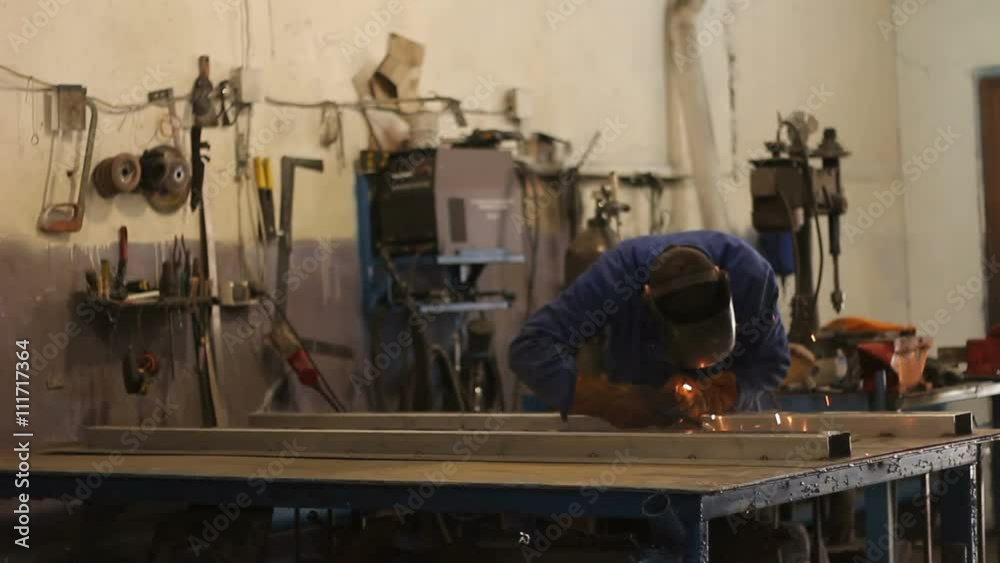 Welder at work in metal industry Welder at work in metal industry