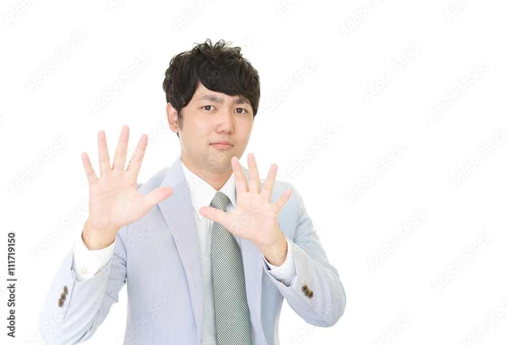ストップのジェスチャーをする男性