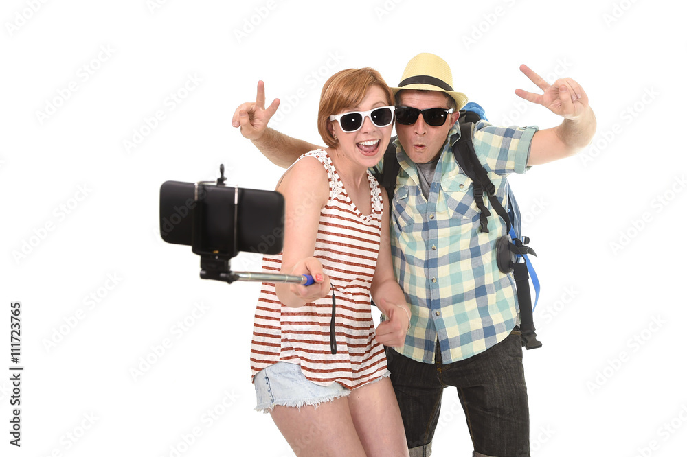 young attractive and chic American couple taking selfie photo with mobile phone isolated on white young attractive and chic American couple taking selfie photo with mobile phone isolated on white