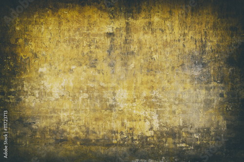 Real wall background, grungy yellow texture.