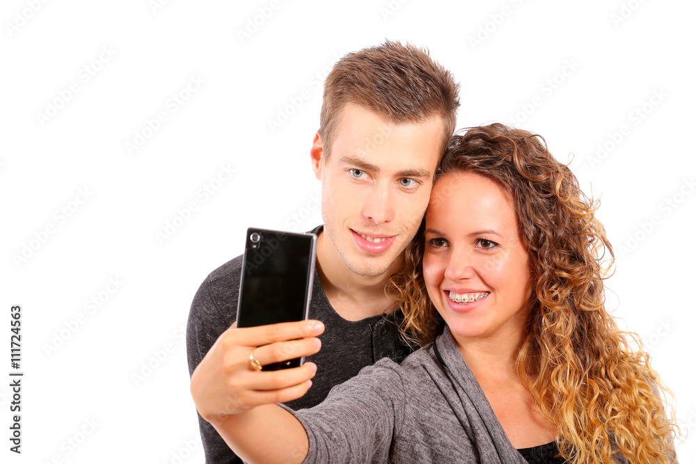 Happy couple taking a selfie on white background Happy couple taking a selfie on white background