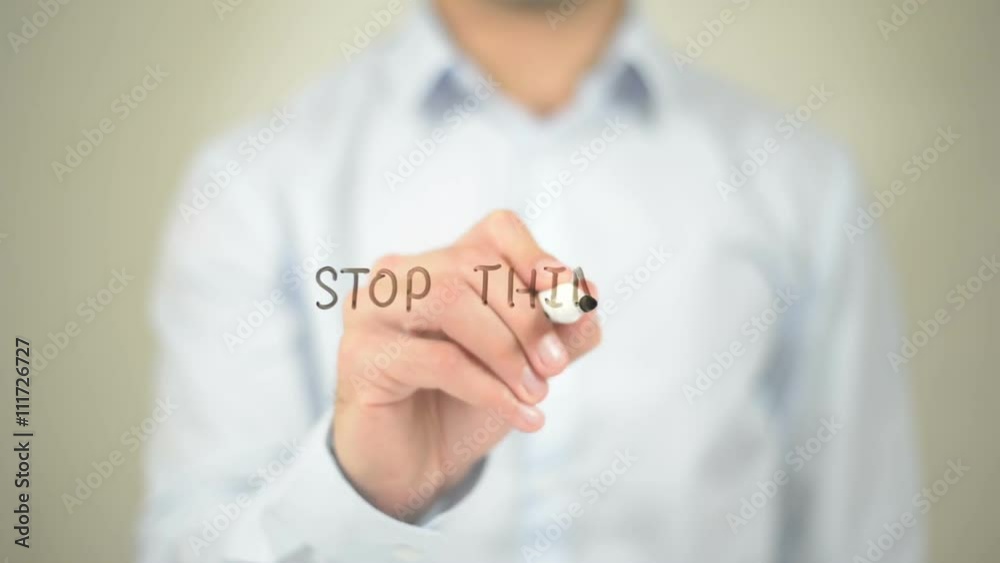 Stop Thinking, Man Writing on Transparent Screen Stop Thinking, Man Writing on Transparent Screen