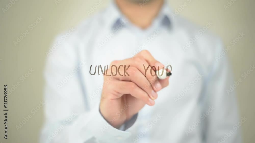 Unlock Your Potential, Man Writing on Transparent Screen Unlock Your Potential, Man Writing on Transparent Screen