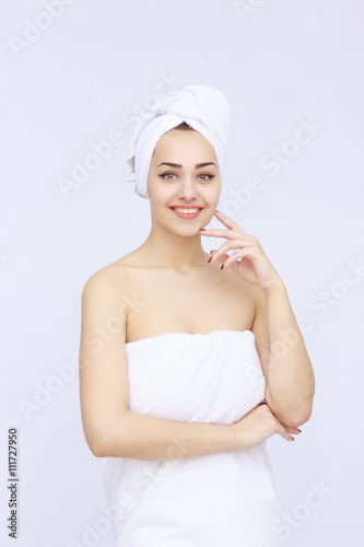 young beautiful woman wrapped in towel
