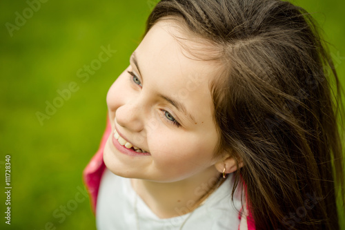 Happy smiling small girl outdoor