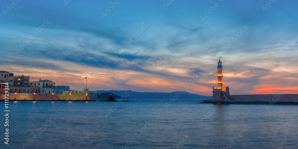 Panorama venetian harbour waterfront and Lighthouse in old harbour of Chania at sunset, Crete, Greece