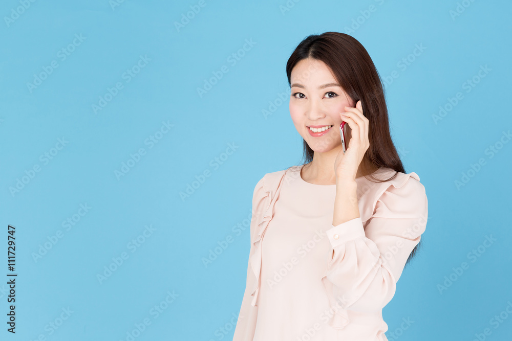 portrait of asian woman talking isolated on blue background portrait of asian woman talking isolated on blue background