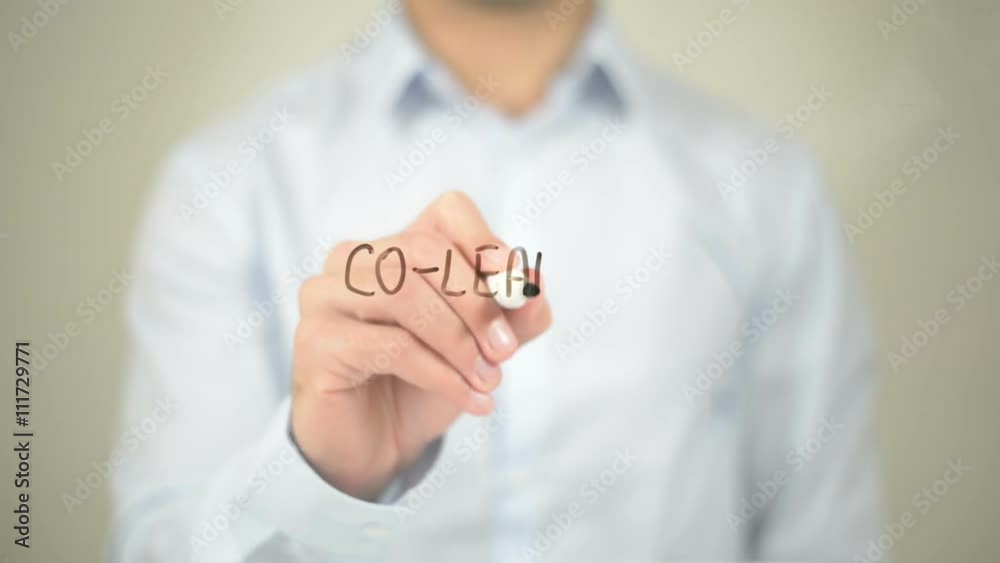Co-Leading, Man writing on transparent screen Co-Leading, Man writing on transparent screen