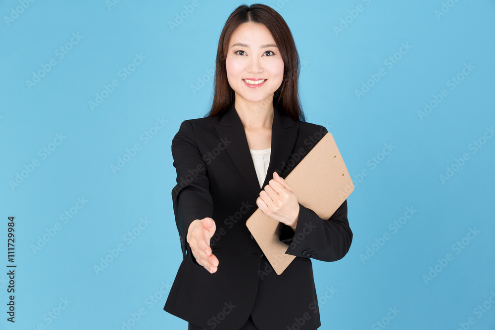 portrait of asian businesswoman shaking hand isolated on blue background portrait of asian businesswoman shaking hand isolated on blue background