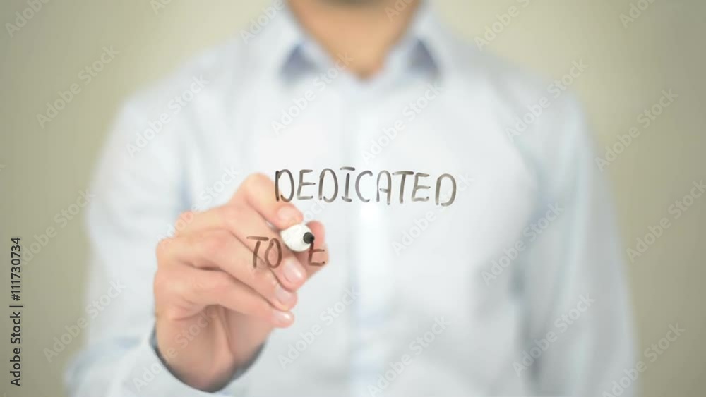 Dedicated to Excellence, Man writing on transparent screen Dedicated to Excellence, Man writing on transparent screen