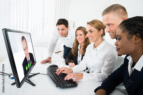 Businesspeople Videoconferencing On Computer