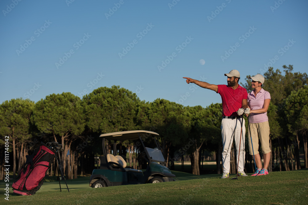 portrait of couple on golf course