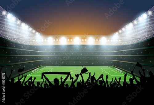 Excited crowd of people at a soccer stadium. Football stadium.