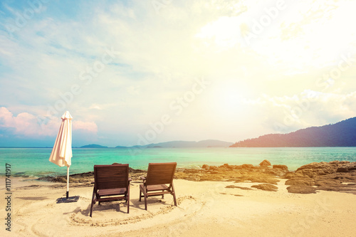 Holiday vacation, beach chairs on the beach, vacation time on the beach concepts, vintage tone, soft focus