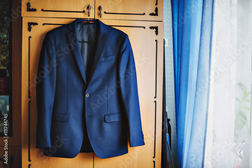 Dark blue in a small checkered formal men suit jacket.