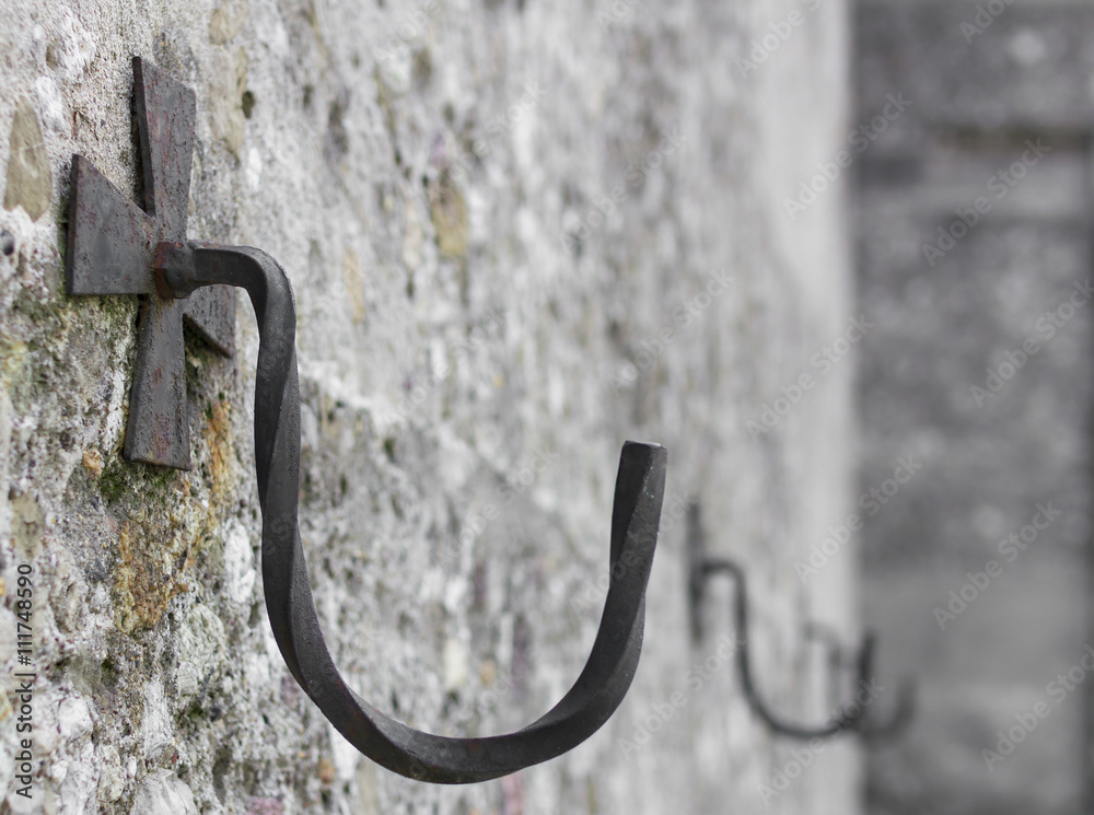 Iron hook on wall