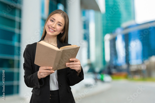 Smiling girl with books © fotofabrika