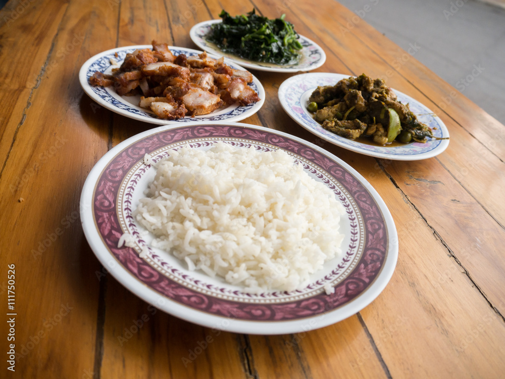Thai food meal , crispt pork , fried vegetable , rice , spicy ch
