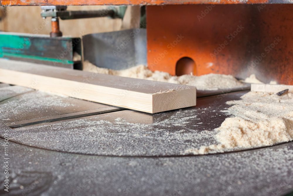 Wooden plank on a circular saw Wooden plank on a circular saw