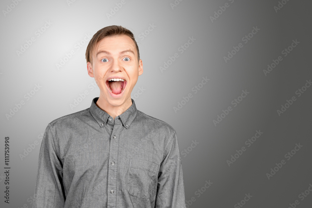 Portrait of young man with shocked facial expression Portrait of young man with shocked facial expression