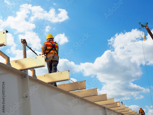 Man Working on the Working at height with blue sky