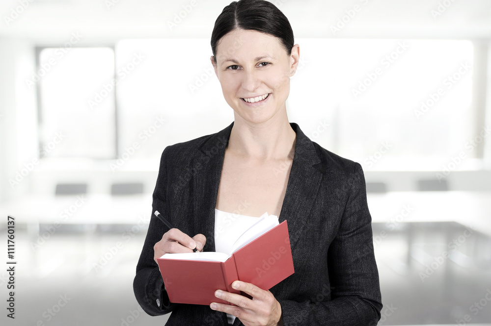 Nice business woman in the office with copy space waiting the new colleagues Nice business woman in the office with copy space waiting the new colleagues