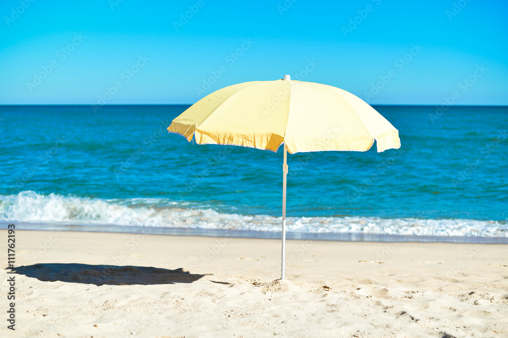 Umbrella on stunning tropical beach background vacation 