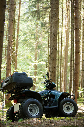ATV's parked in the parking lot in the forest. good weather.