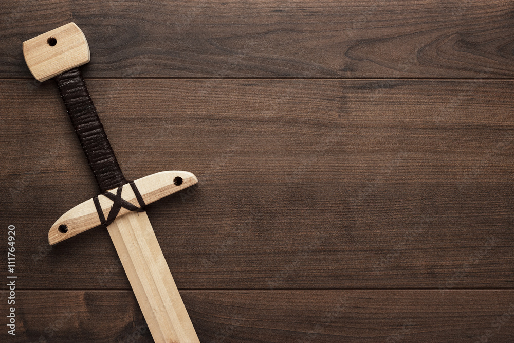 handmade wooden training toy sword on the table