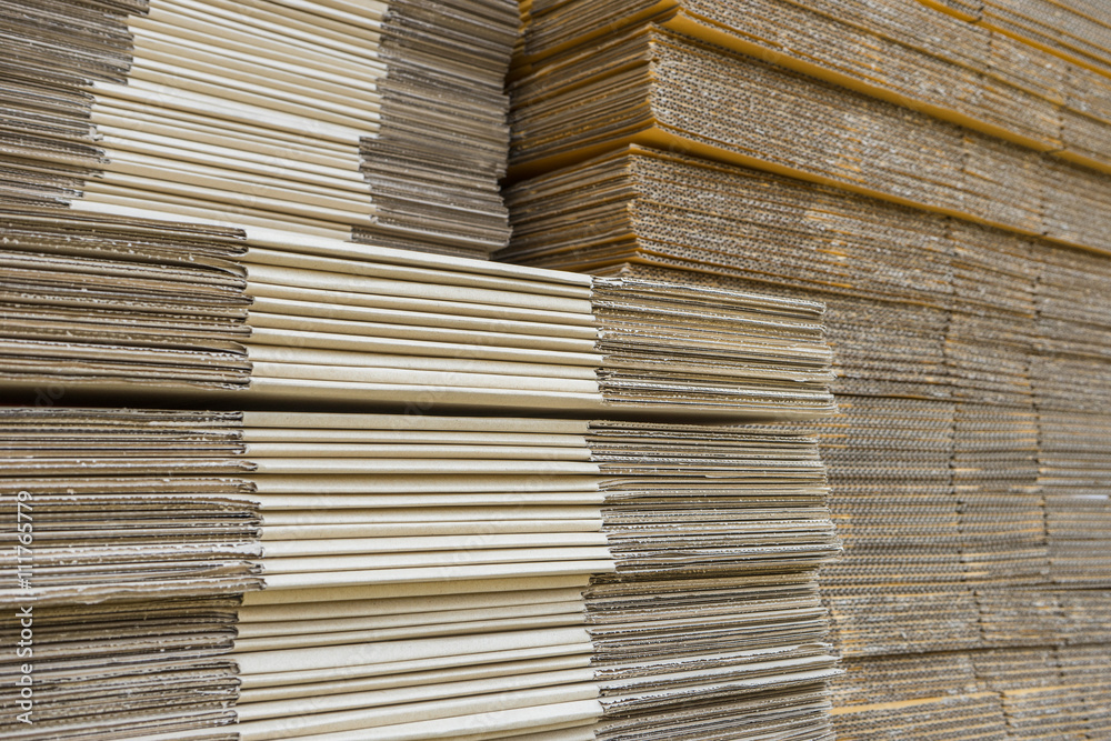 stack of corrugated cardboard boxes. egde view of flattened boxe stack of corrugated cardboard boxes. egde view of flattened boxe
