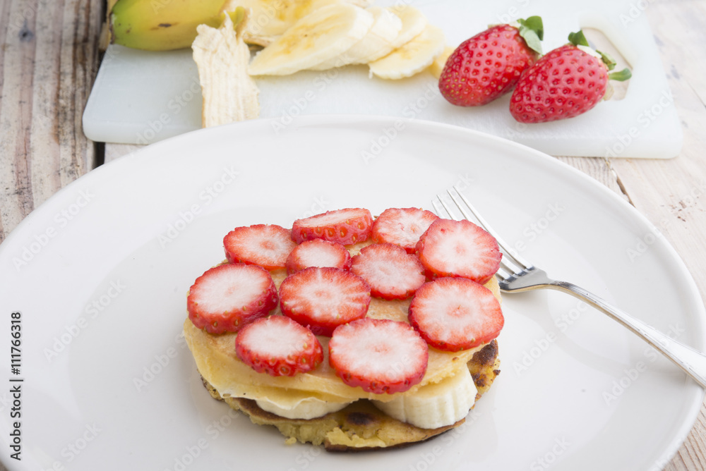 Stack of golden pancakes with strawberries, banana, Stack of golden pancakes with strawberries, banana,