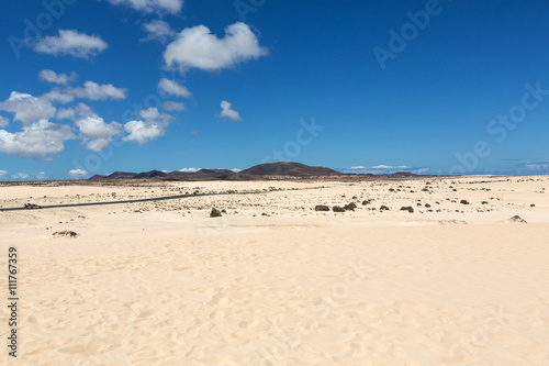 Corralejo sand dunes and extinct volcanoes in the background. Fuerteventura, Canary Islands, Spain
