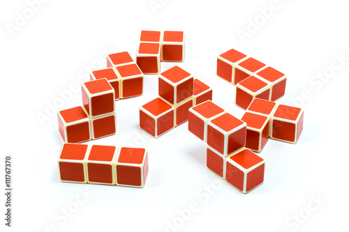 Elements of old soviet red plastic cube puzzle on white background