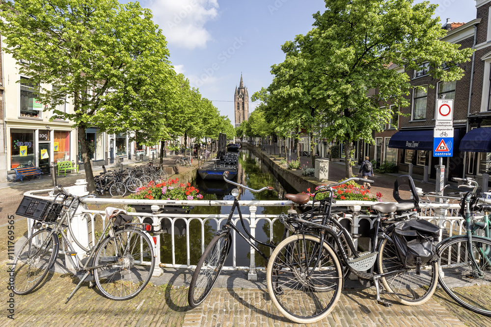 Canal in the center of delft with the classic bike