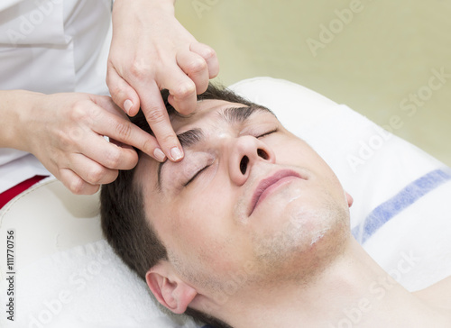 man in the mask cosmetic procedure in spa salon