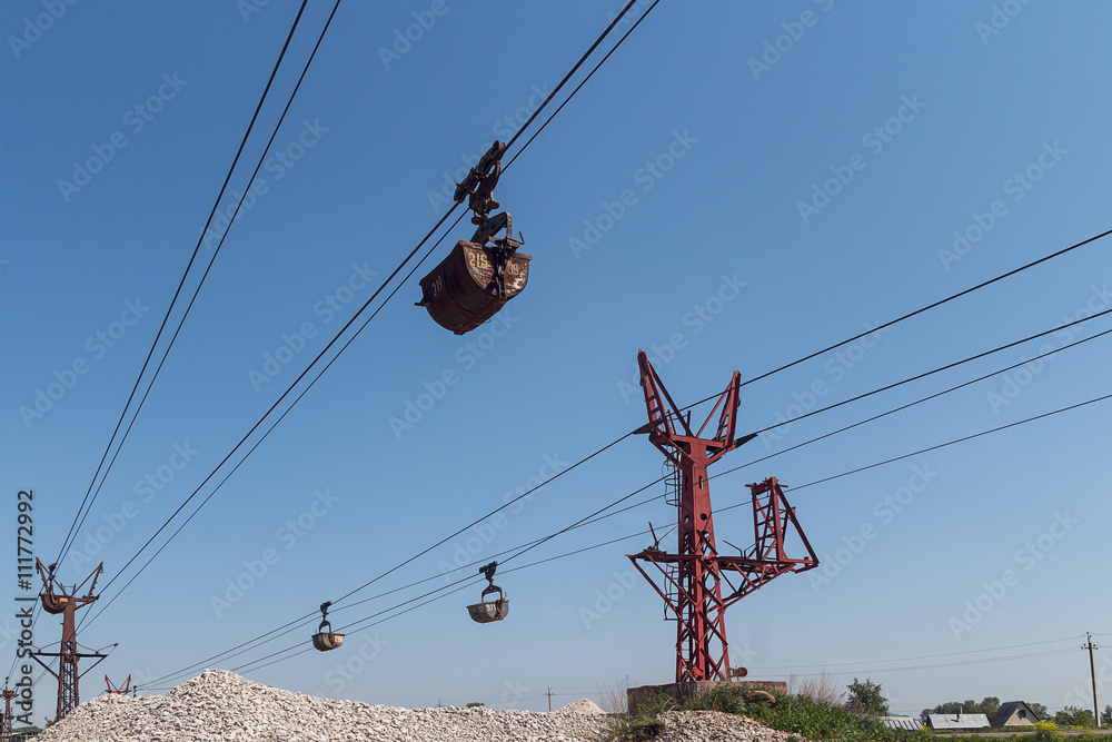 Limestone mining and transportation via cable car.