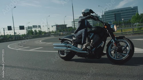 Business man riding a motorcycle in a city