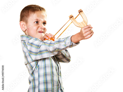 Fotografie Kid holding slingshot in hands