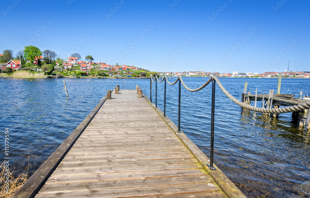 Wooden bridge on spring Swedish bay