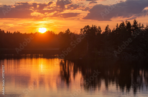 sunset on forest lake