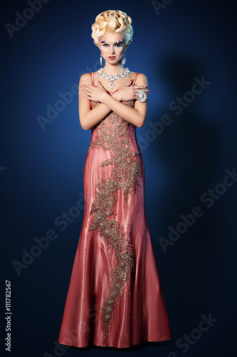 Картината върху платно Beautiful woman make up hair style luxury pink dress
