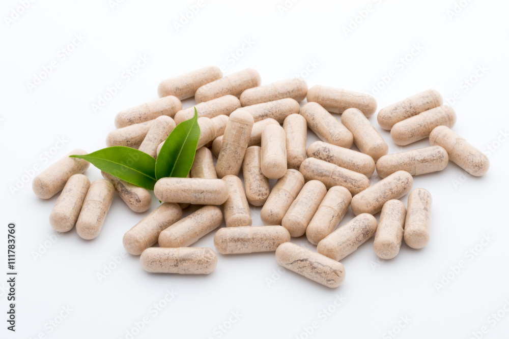 Ginkgo biloba capsule on the white background.