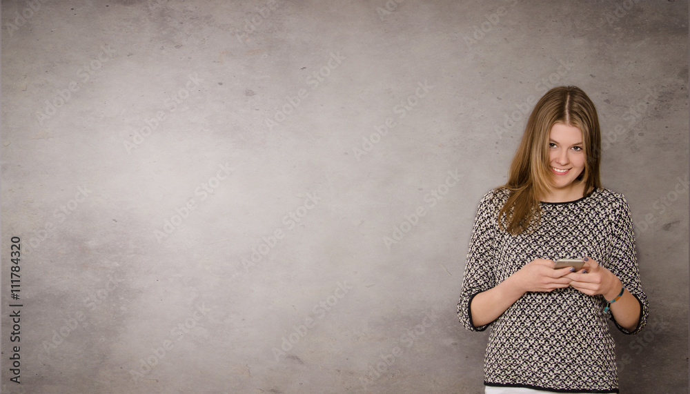 Happy teenager with a mobile phone