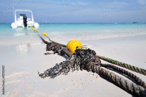 Yellow buoy and rope on the Beautiful beach in thailand