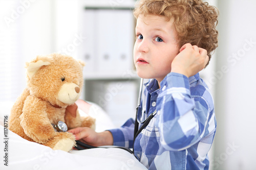  Child Doctor Checking a Teddy Bear's Heartbeat.